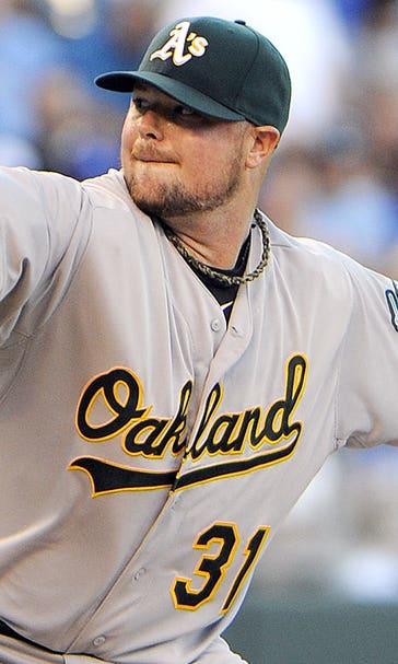 Lester 3-0 since trade, A's tally 20 hits, rout 1st-place Royals 11-3